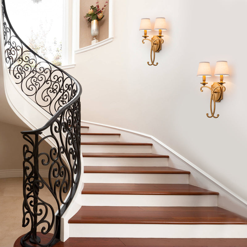 Entryway wall sconce by staircase