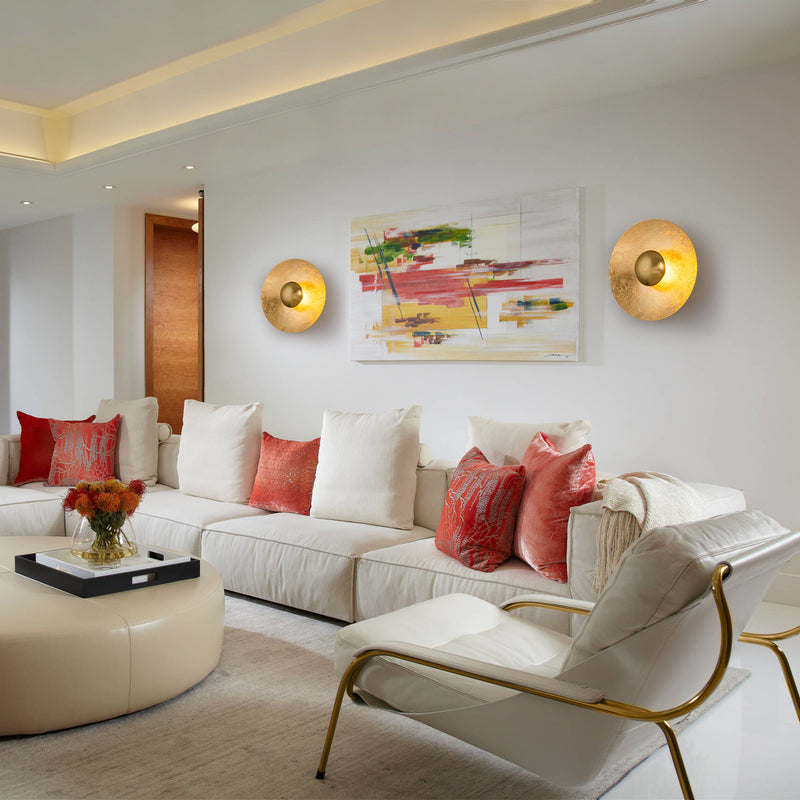 Living room wall lighting with warm brass sconces