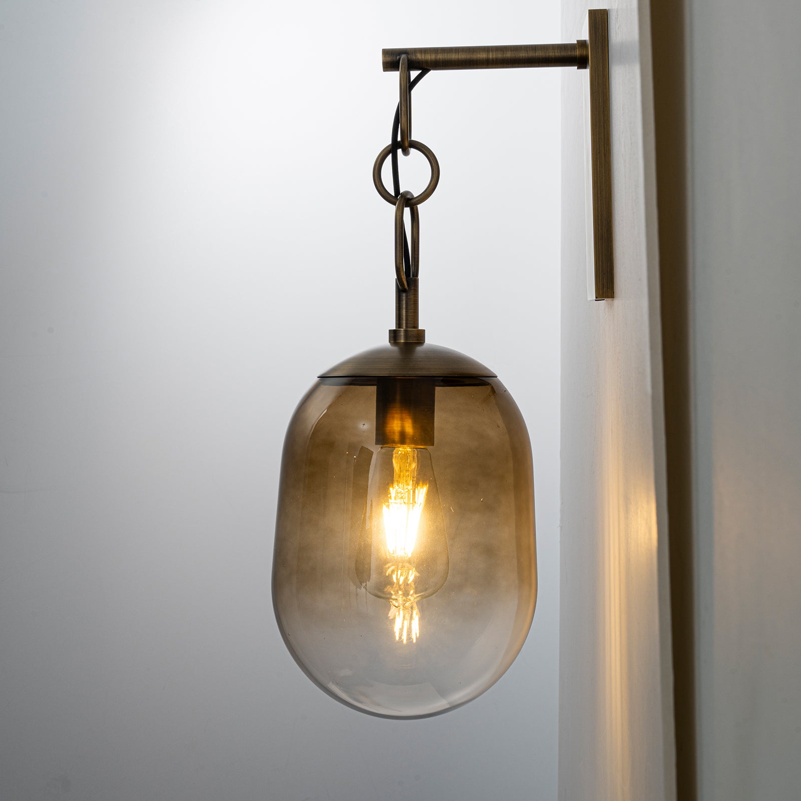 7.09 in. 1-Light Antique Metal Wall Sconce with Oval Gradient Color Glass Shade for Bedroom, Bathroom, Hallway